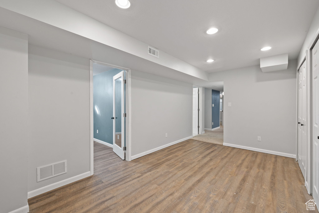 Basement with wood-type flooring