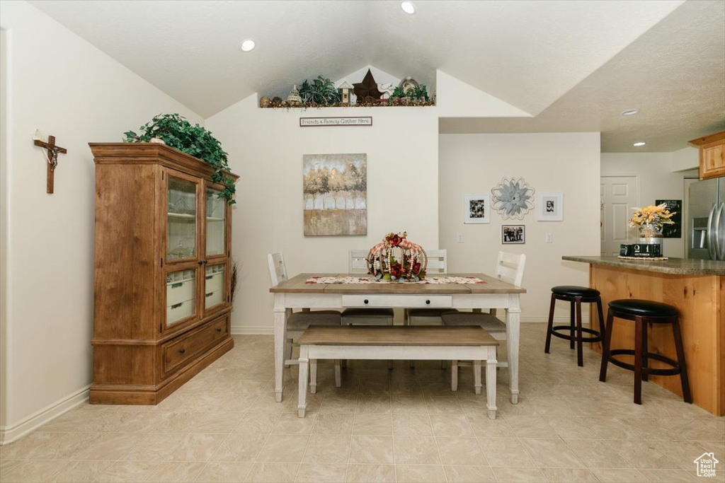 Dining room with vaulted ceiling