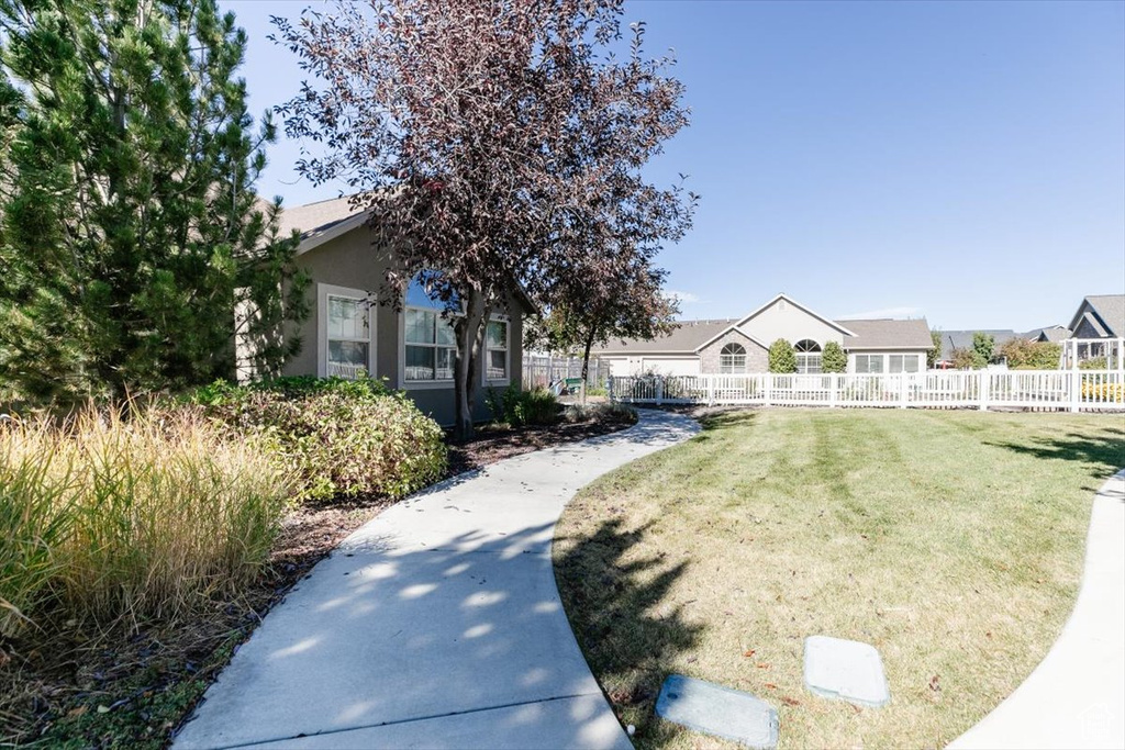 View of front of property with a front lawn