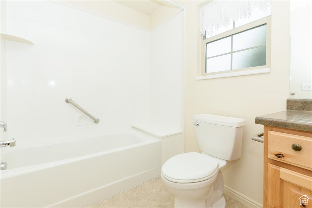 Full bathroom featuring toilet, vanity, and bathing tub / shower combination