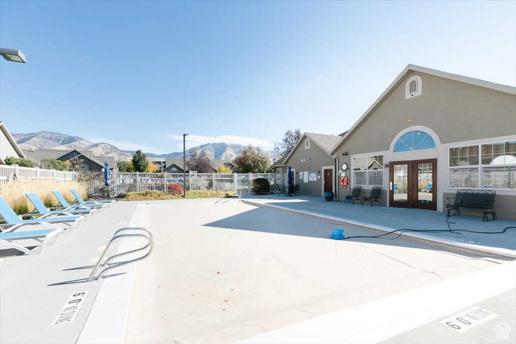 Exterior space with a mountain view and a patio