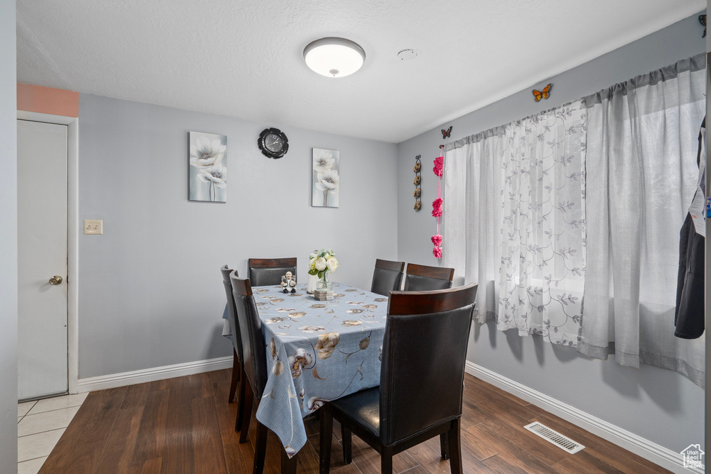 Dining room with hardwood / wood-style flooring