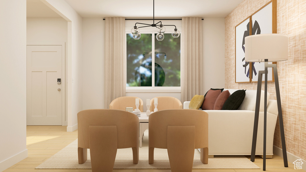 Dining room featuring an inviting chandelier and light hardwood / wood-style flooring