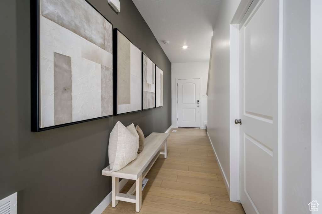 Hallway featuring light wood-type flooring