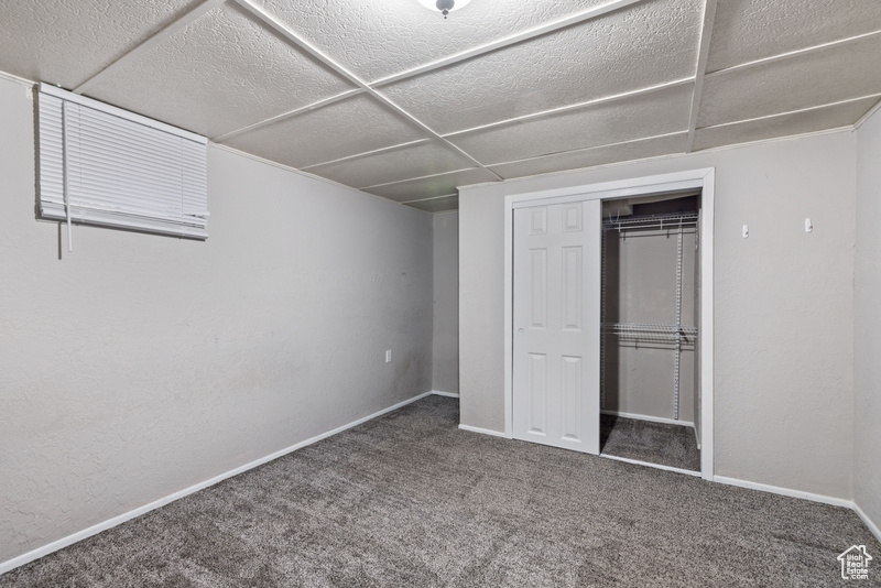 Unfurnished bedroom with a closet and carpet floors