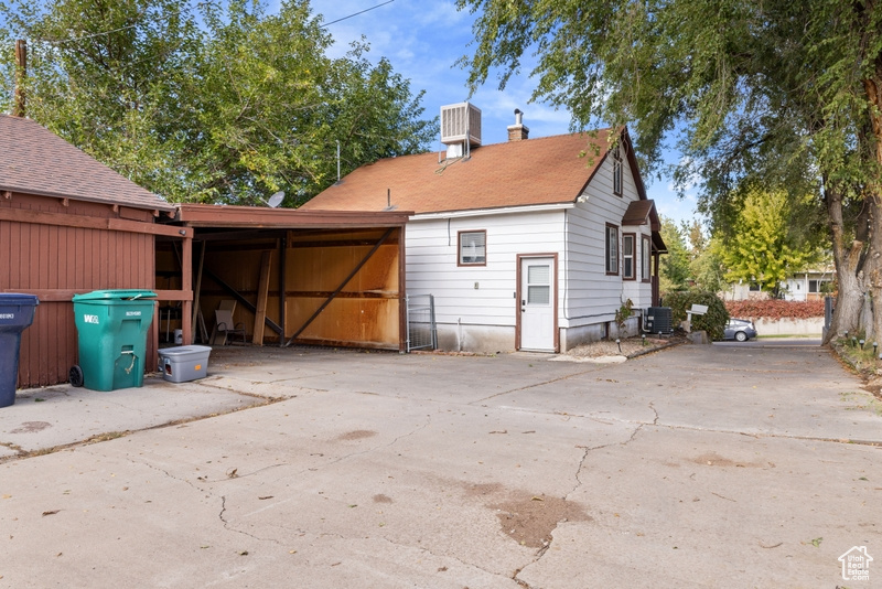 Rear view of property with central air condition unit