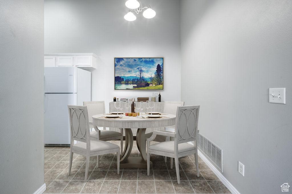 Dining area with a high ceiling