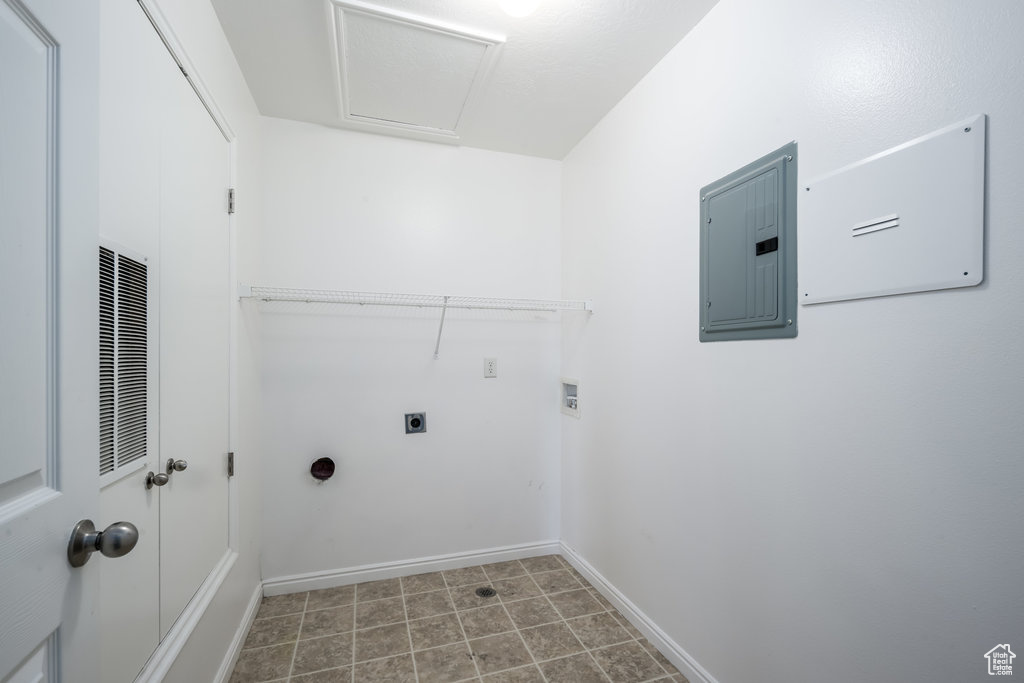 Laundry area featuring hookup for an electric dryer, electric panel, and hookup for a washing machine