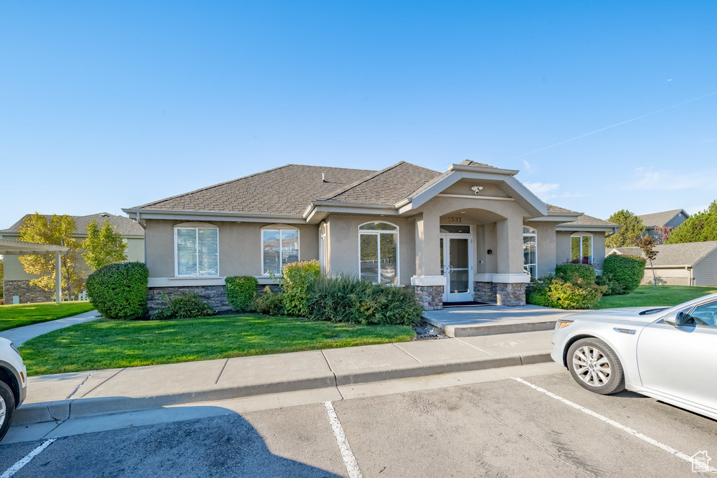 View of front of property with a front lawn