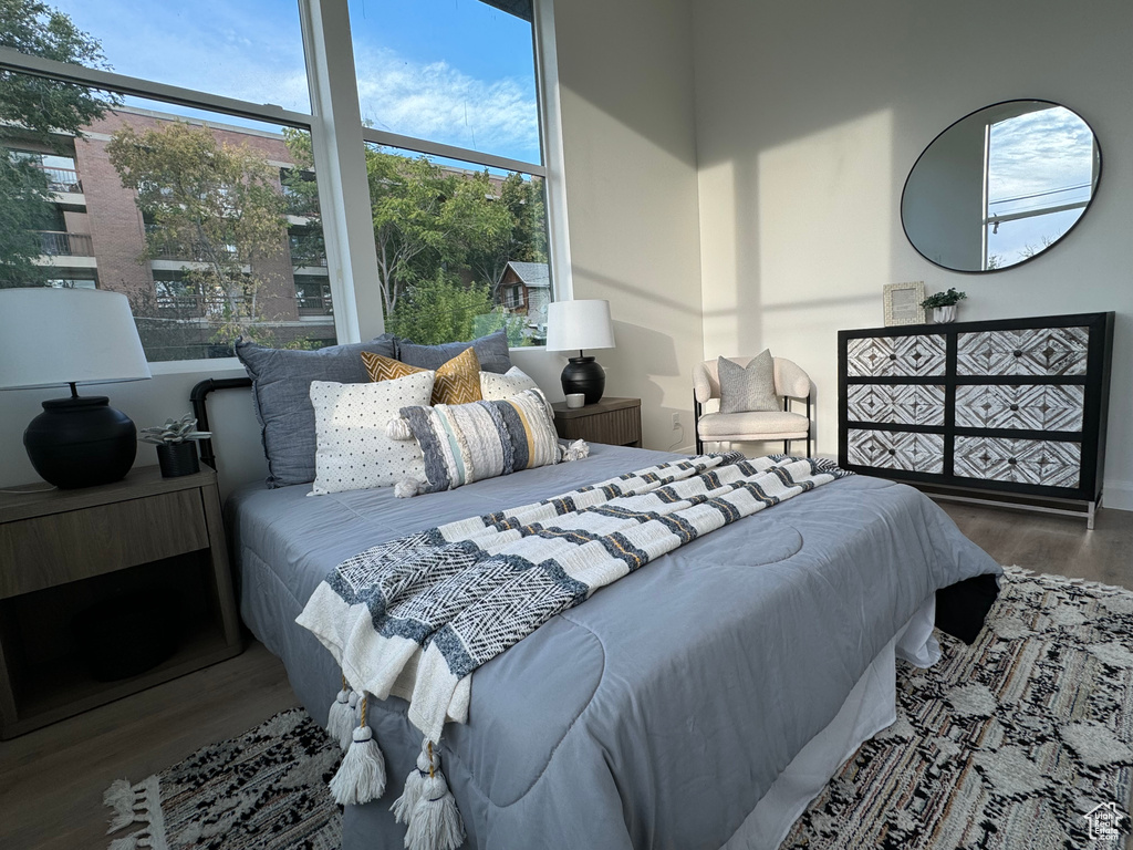 Bedroom with hardwood / wood-style flooring