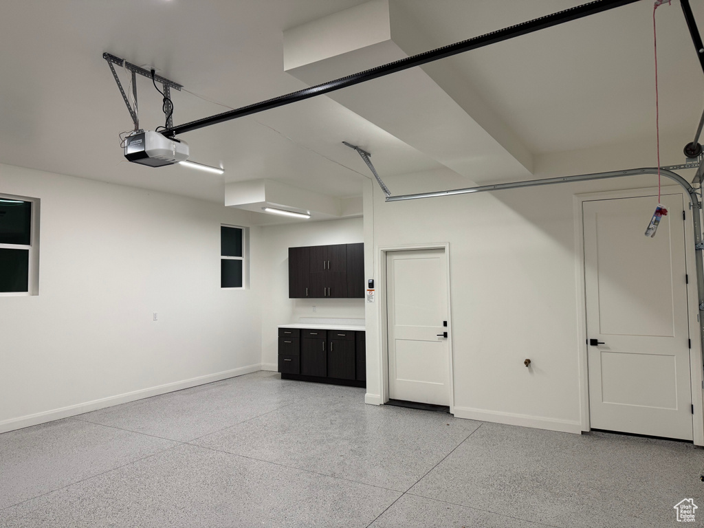 Garage featuring a garage door opener