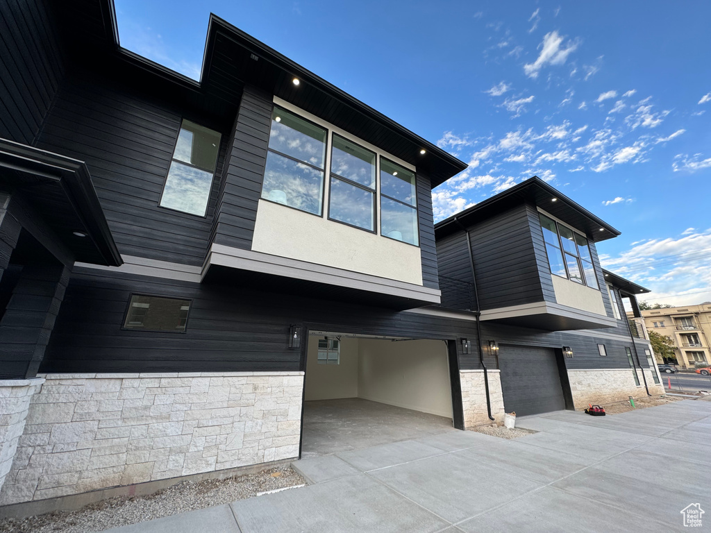 View of side of home featuring a garage