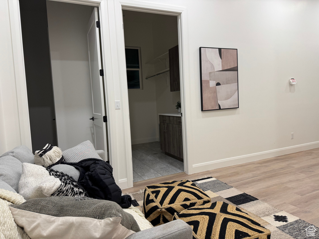 Interior space with ensuite bathroom and light hardwood / wood-style flooring