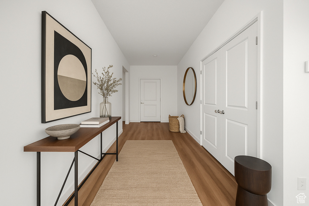 Corridor with baseboards and wood finished floors