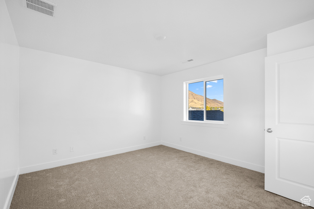 Spare room with light carpet