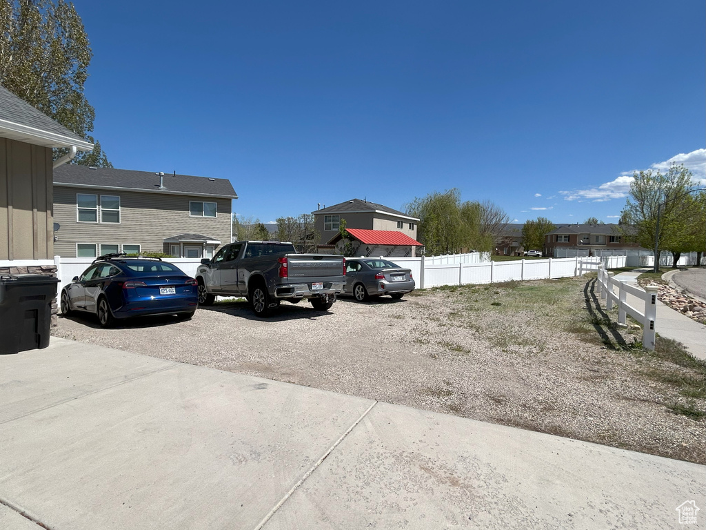 View of car parking featuring fence