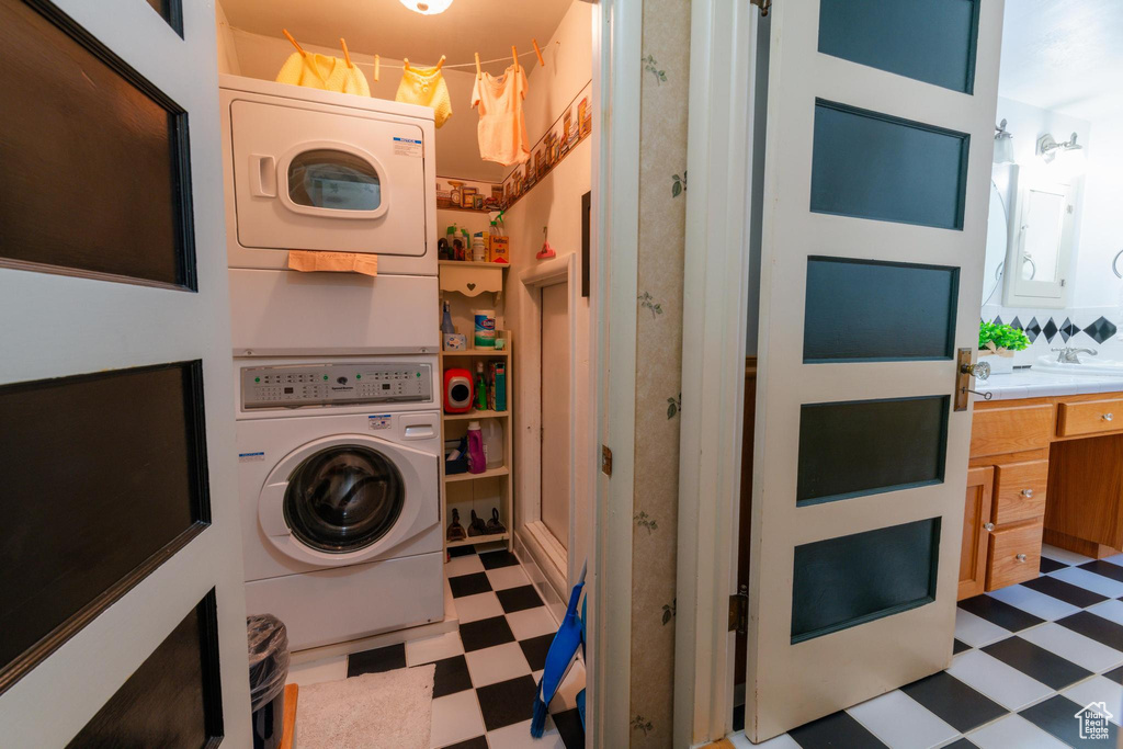 Laundry area featuring stacked washer / dryer