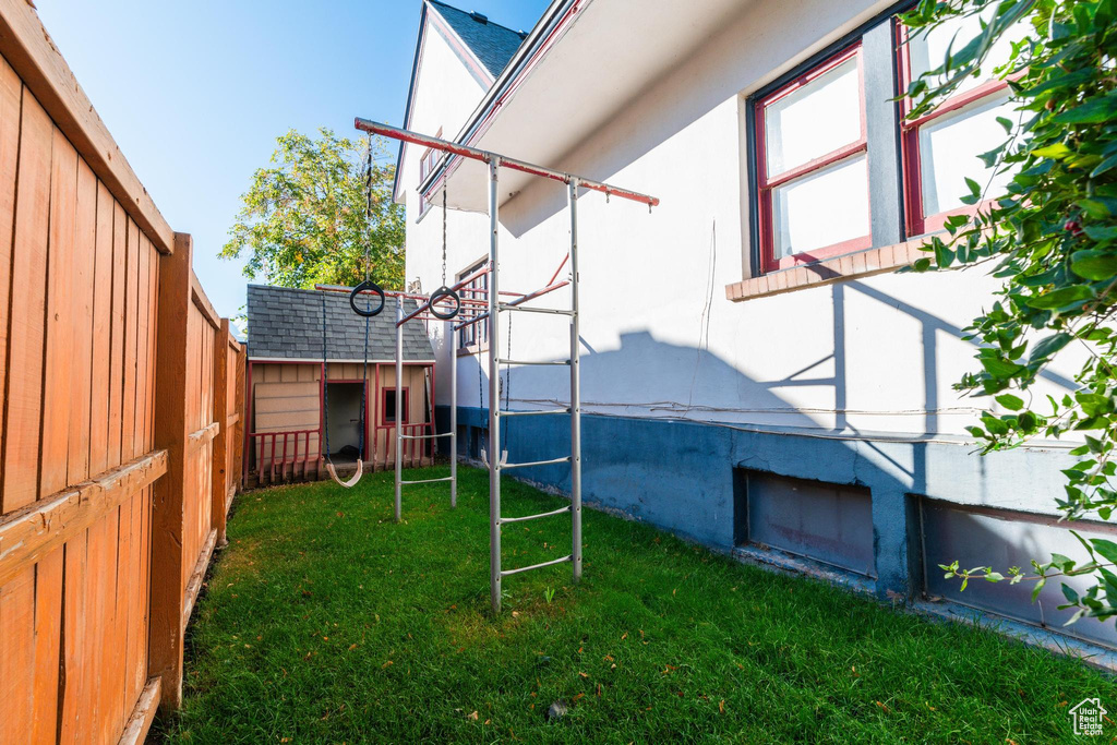 View of yard with a storage unit