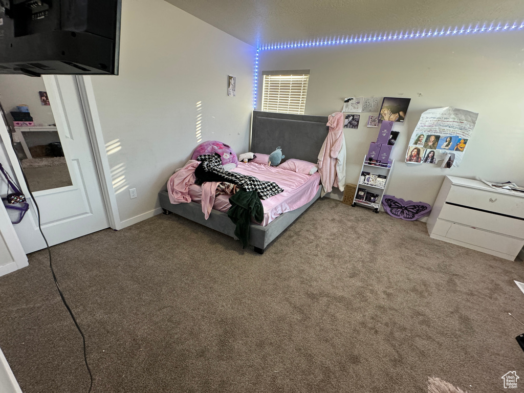 Bedroom featuring carpet floors