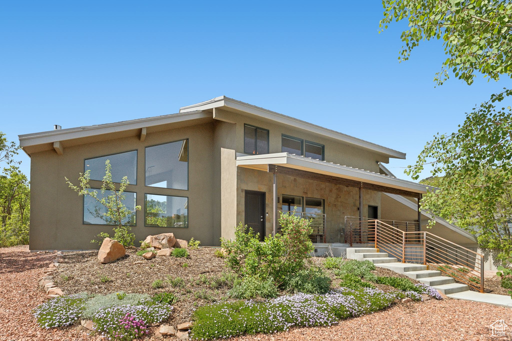 View of front of property with stucco siding and a porch