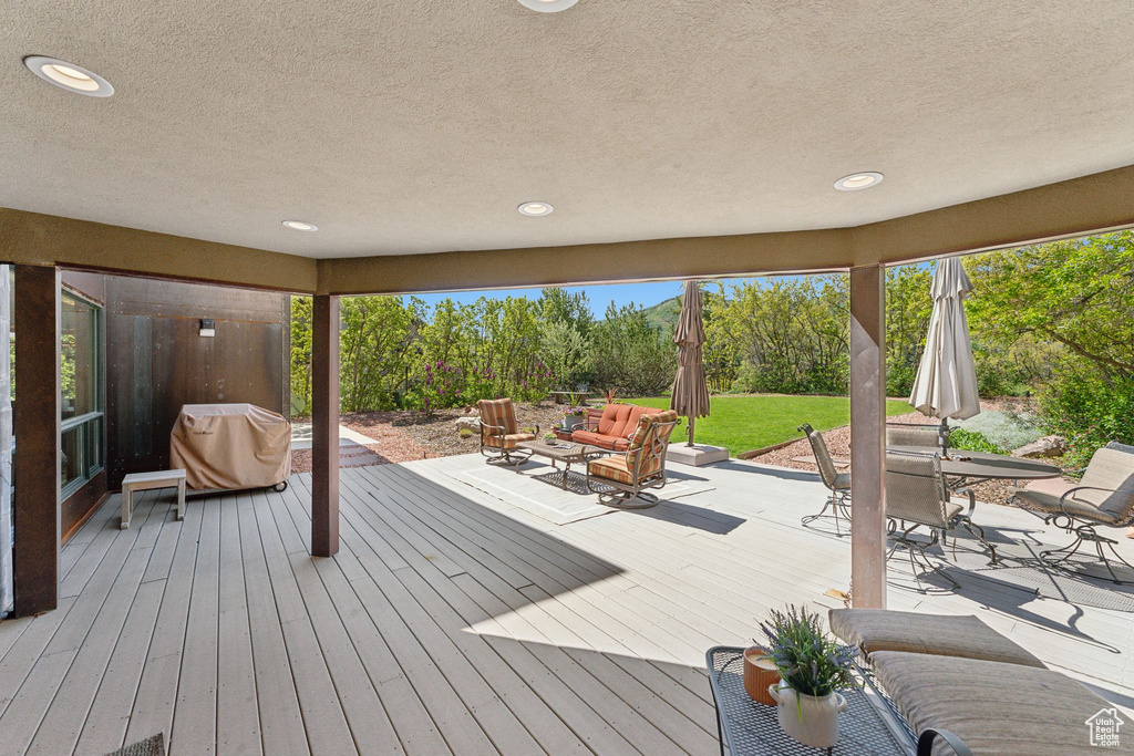 Deck featuring area for grilling, outdoor dining area, and outdoor lounge area