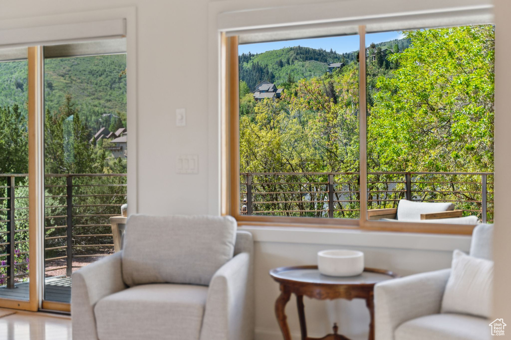 Living area featuring a view of trees