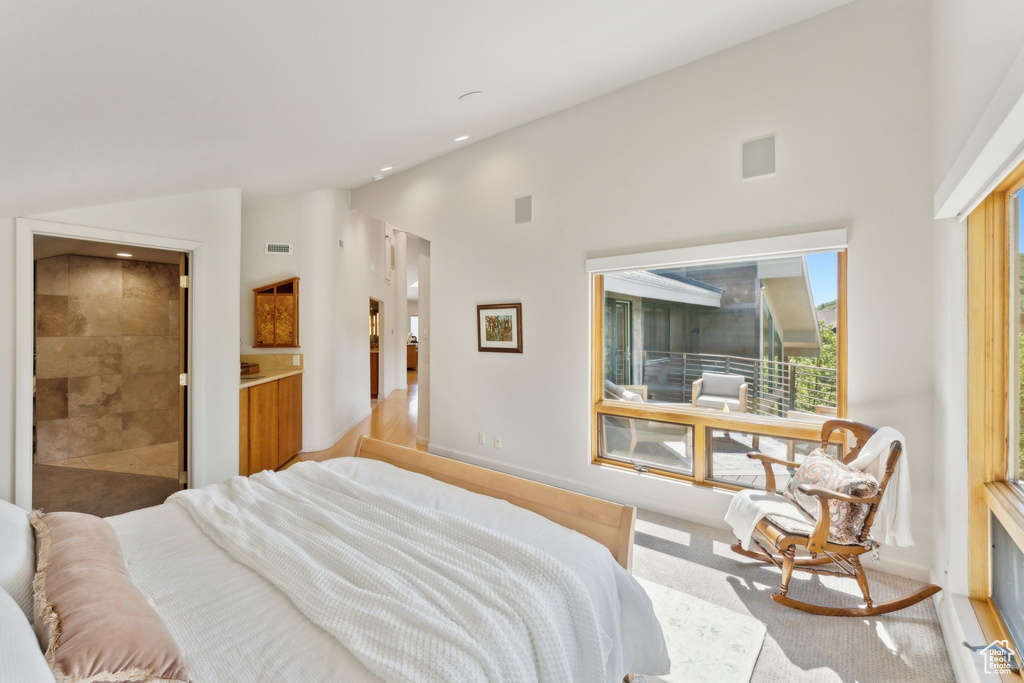 Bedroom with vaulted ceiling, carpet, recessed lighting, and baseboards