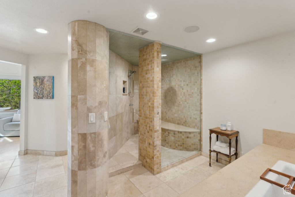 Full bathroom with a walk in shower, recessed lighting, tile patterned flooring, vanity, and baseboards