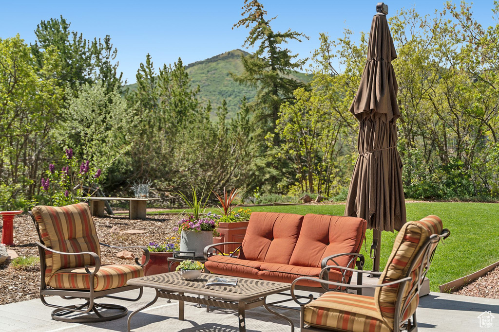 View of patio / terrace featuring a mountain view and an outdoor living space