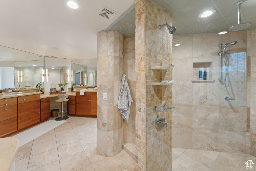 Bathroom with walk in shower, vanity, recessed lighting, and tile patterned flooring