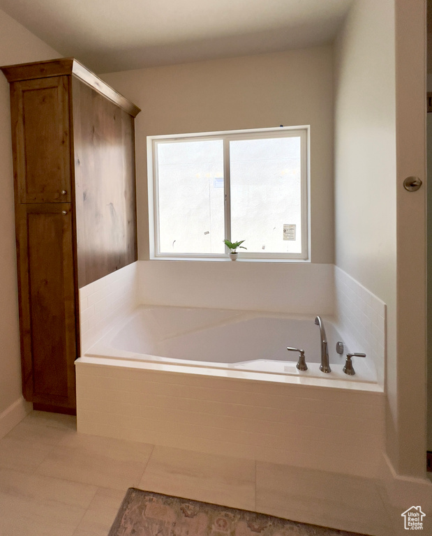 Full bathroom featuring a garden tub