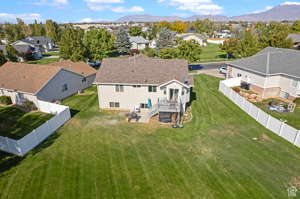 Birds eye view of property with a mountain view