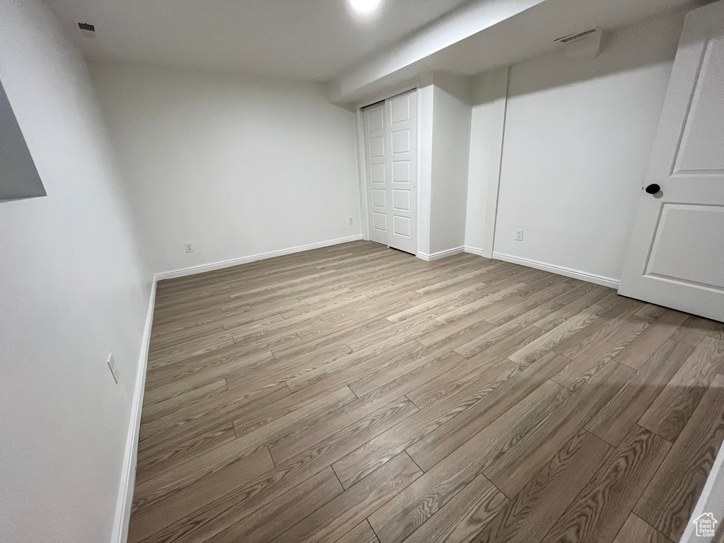 Unfurnished bedroom featuring light hardwood / wood-style floors