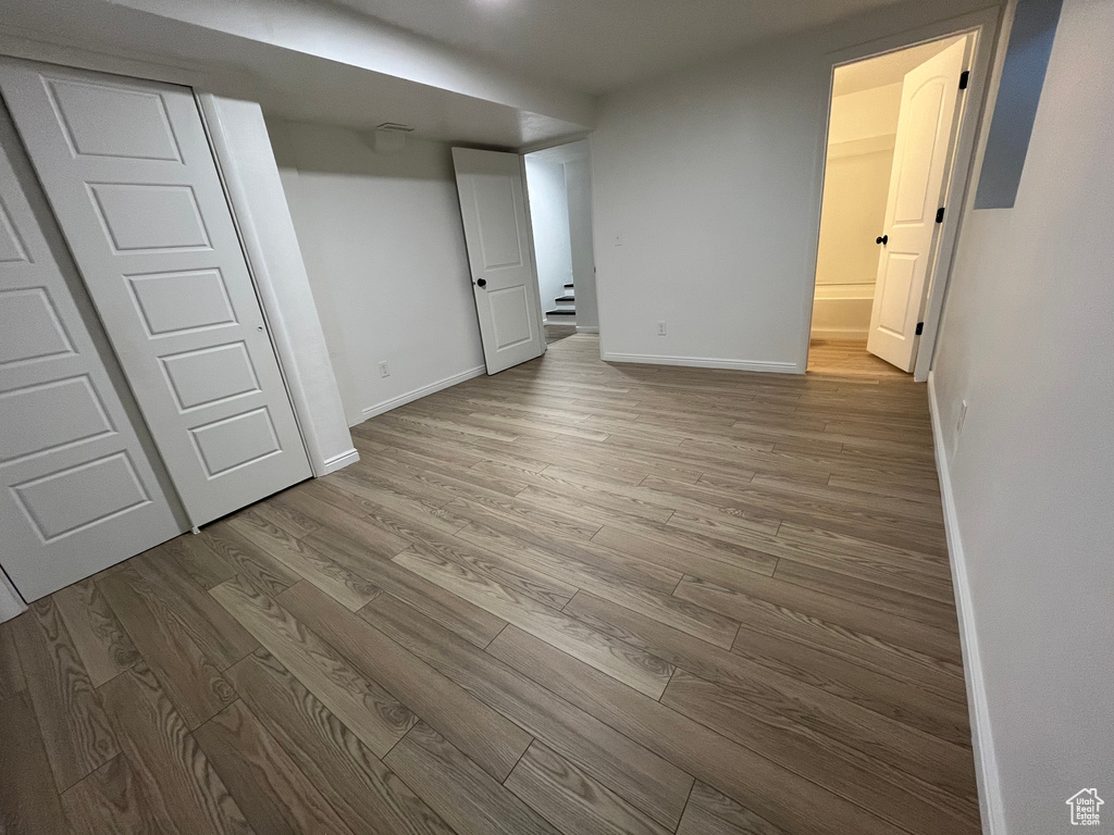 Unfurnished bedroom featuring light hardwood / wood-style flooring and a closet