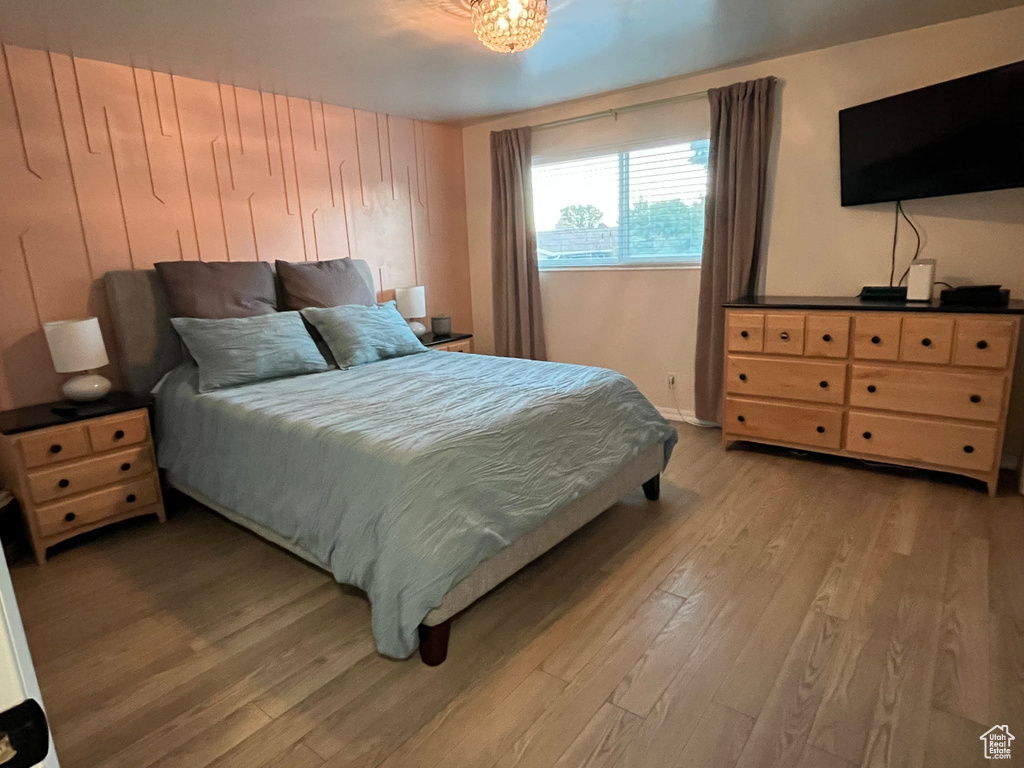 Bedroom with light hardwood / wood-style floors