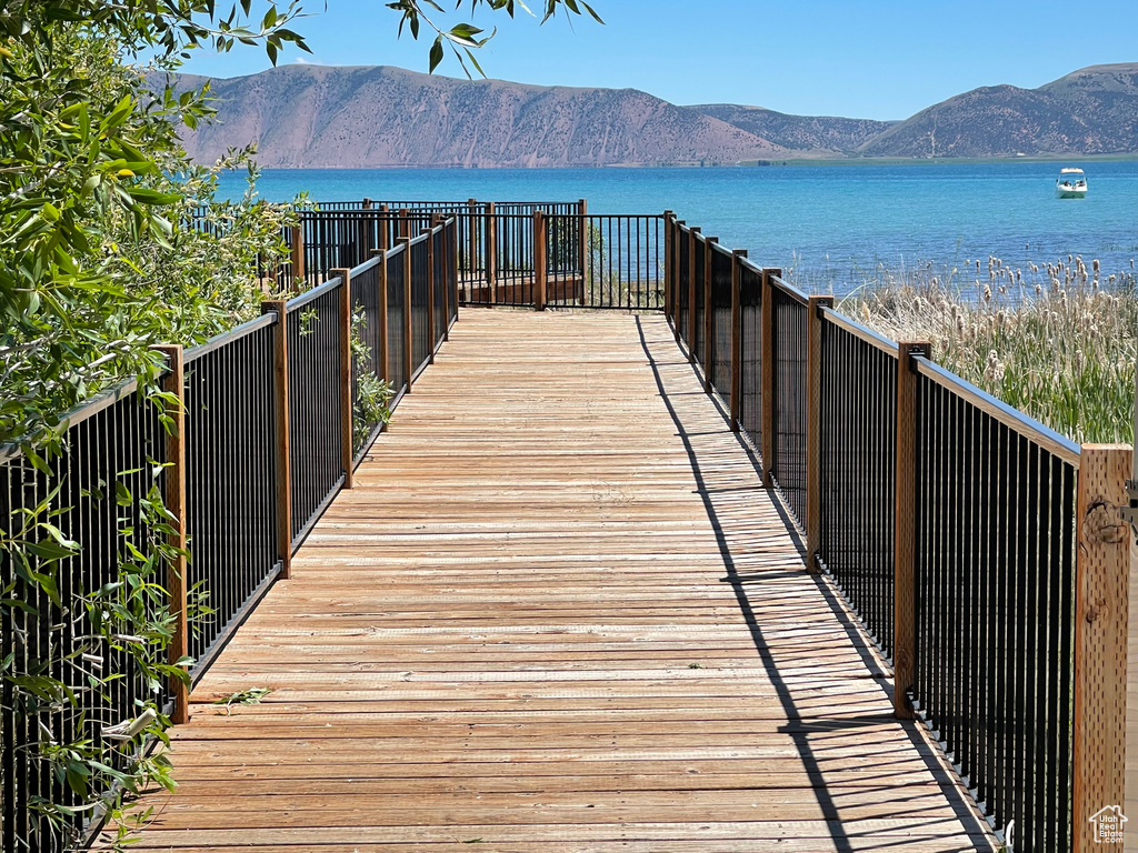 View of dock with a water and mountain view