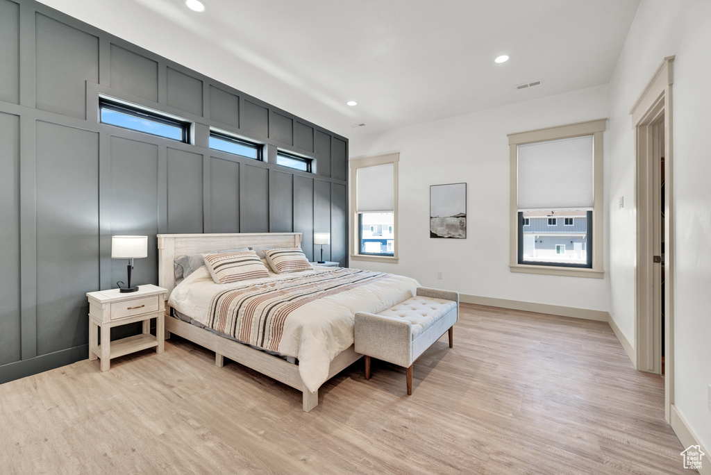 Bedroom with light hardwood / wood-style floors