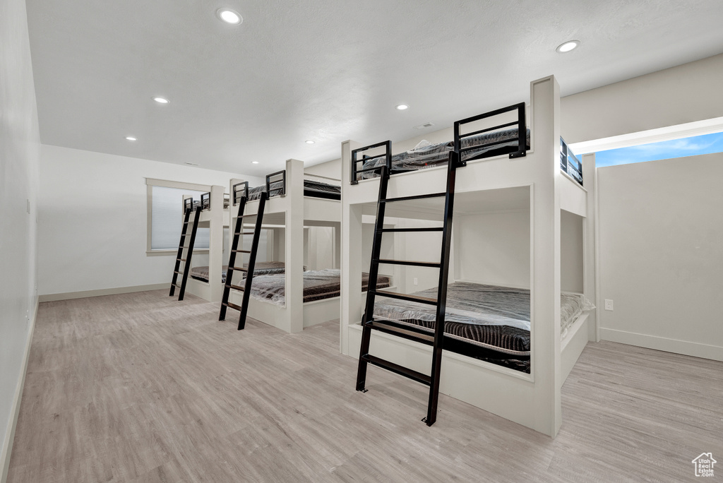 Unfurnished bedroom featuring light hardwood / wood-style floors