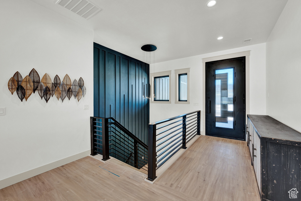 Foyer entrance with light hardwood / wood-style flooring