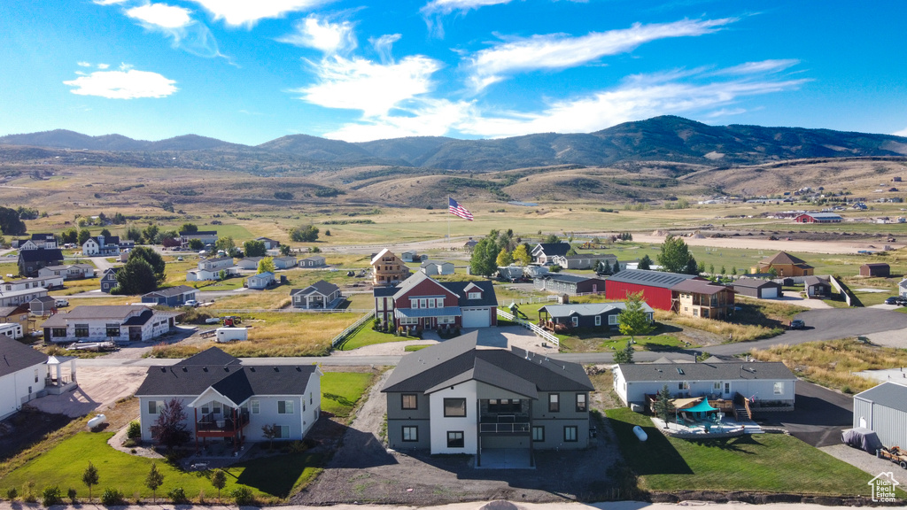 Birds eye view of property with a mountain view