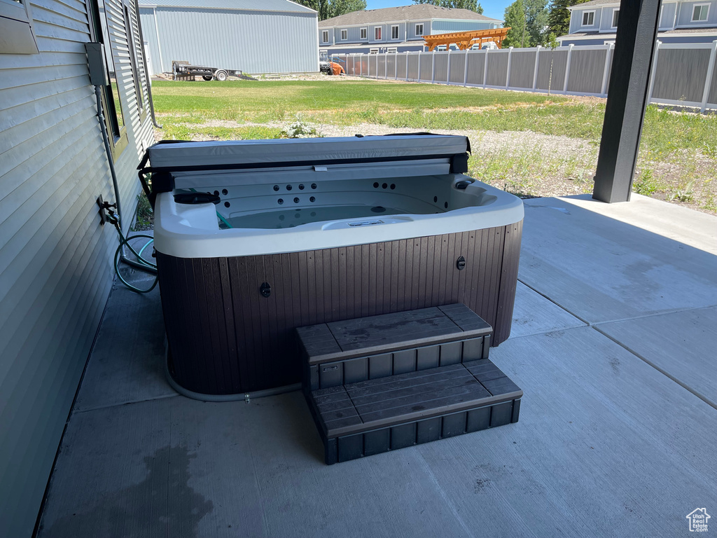 View of patio featuring a hot tub