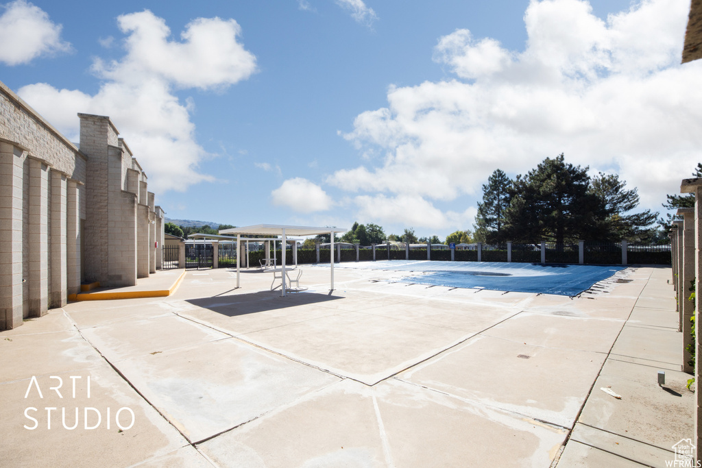 View of swimming pool with a patio