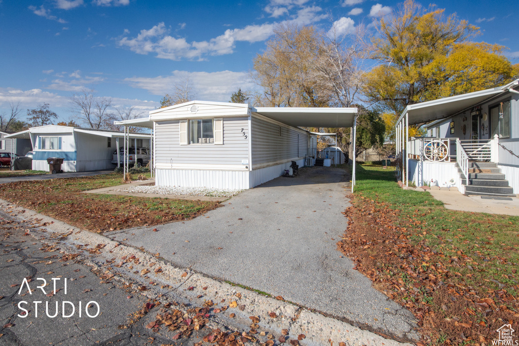 View of side of home featuring a carport