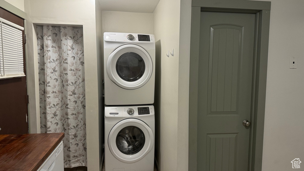 Washroom with stacked washer / drying machine