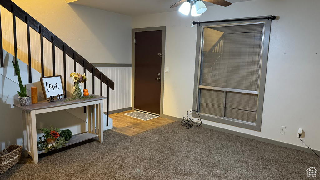 Foyer entrance featuring hardwood / wood-style flooring and ceiling fan