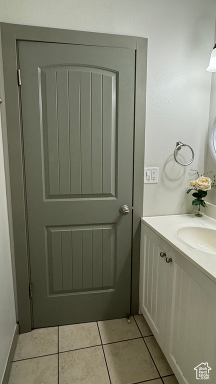 Bathroom with vanity and tile patterned floors