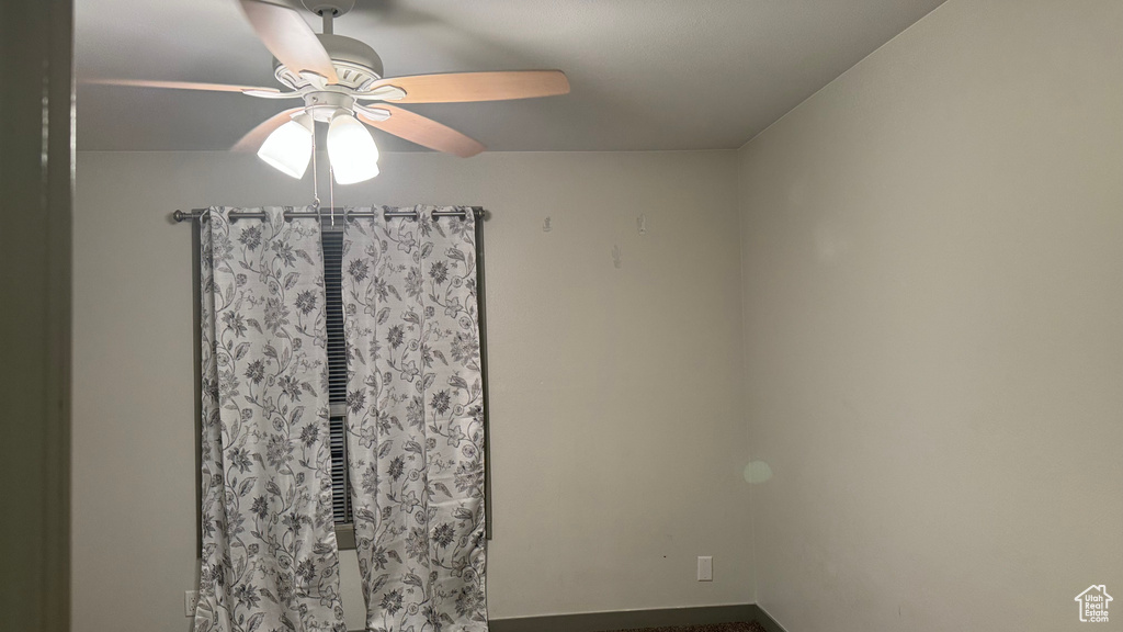 Unfurnished room featuring ceiling fan