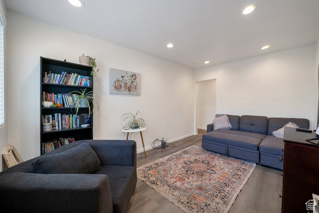 Living room with dark hardwood / wood-style floors