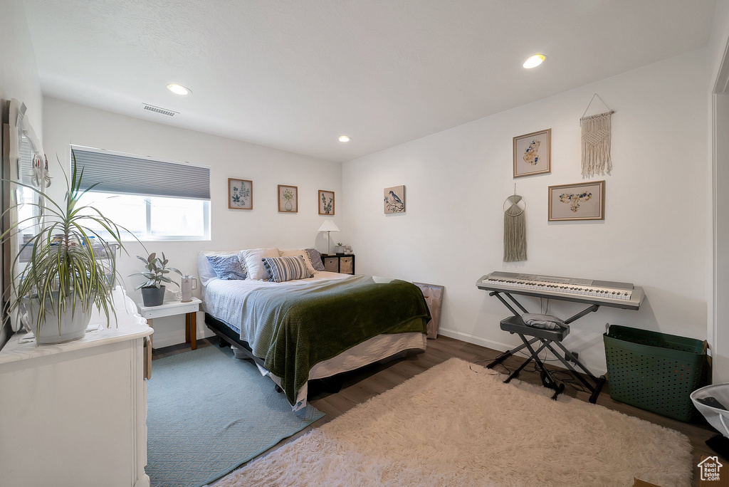 Bedroom with wood-type flooring