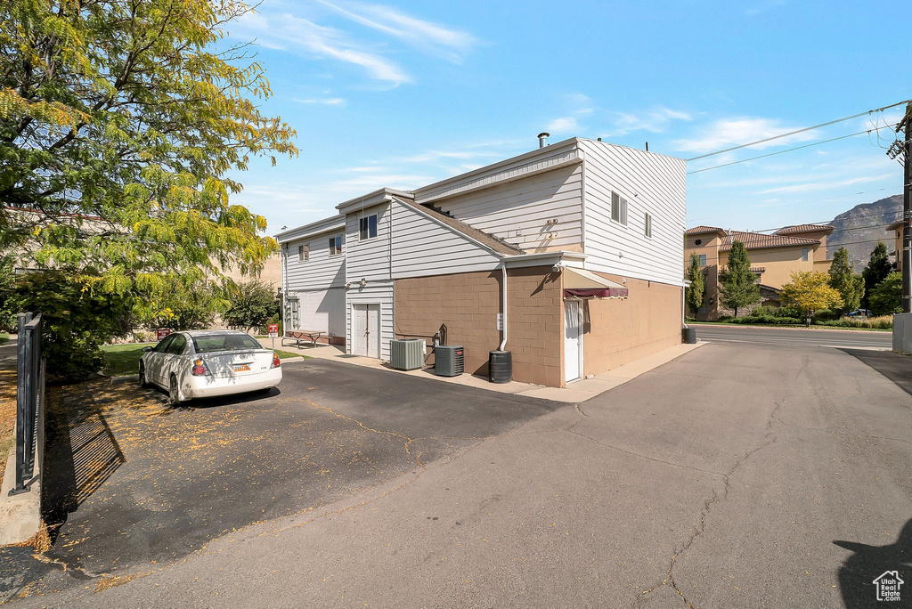 View of property exterior featuring a garage